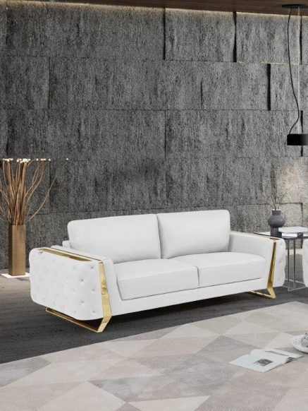 A modern white sofa with a gold frame