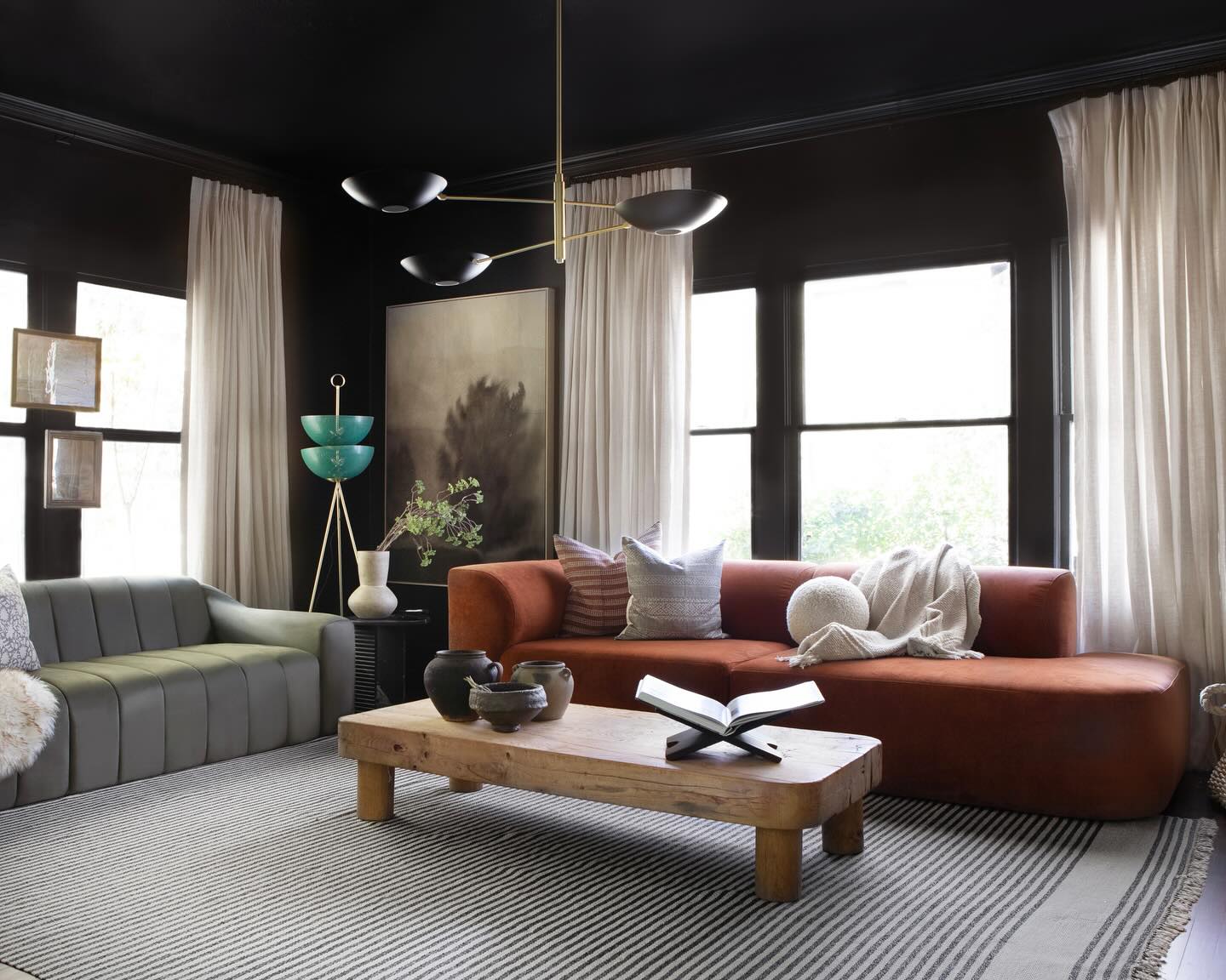 Living room with an orange and gray sofa from the NUEVO brand
