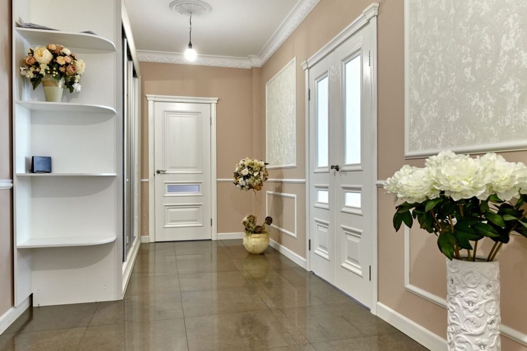 A Small Entrance Room Big Hallway White Doors