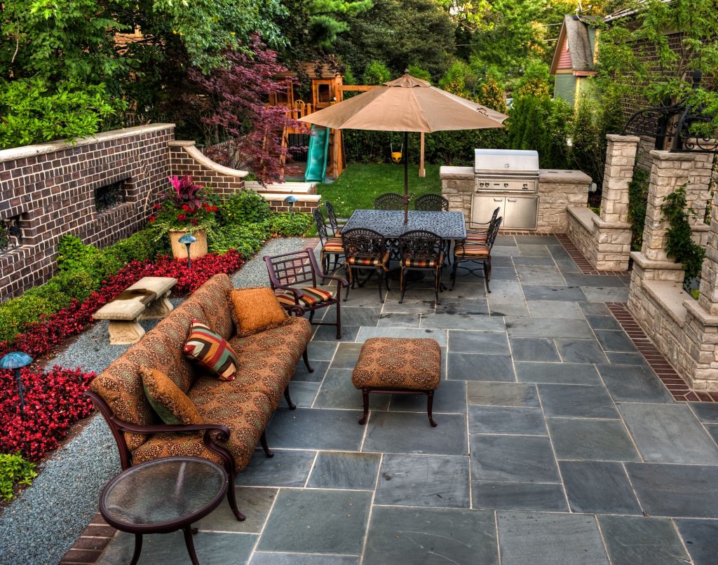 Backyard Patio In Garden With Forged Outdoor Furniture