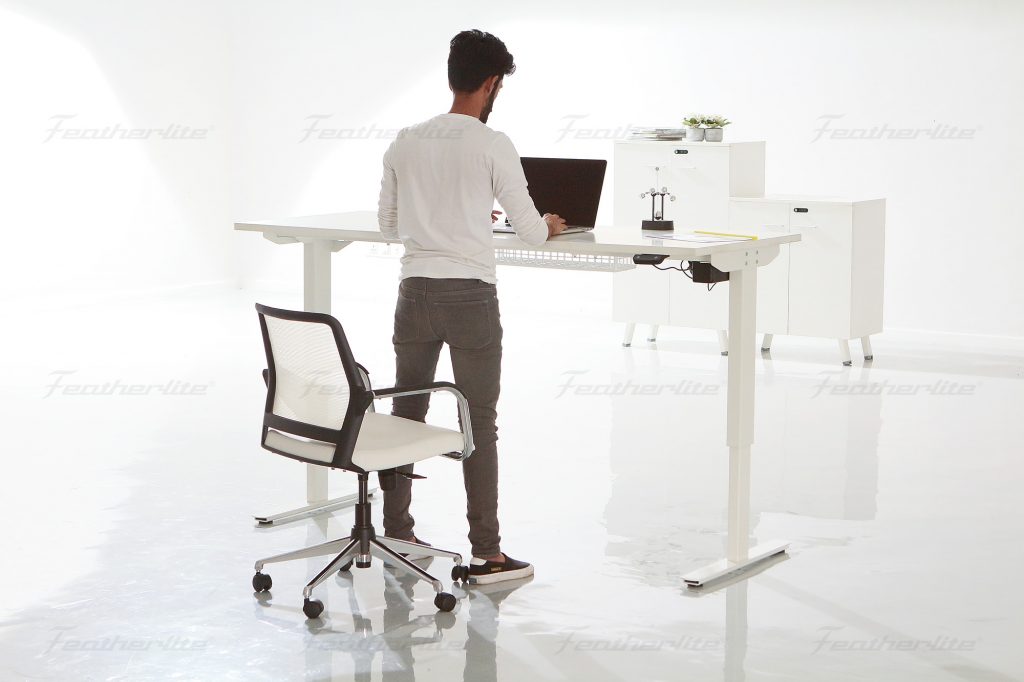 Working at home standing at the height adjustable desk