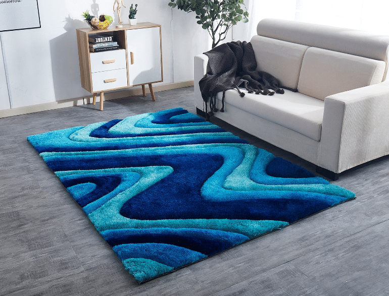 Get the feeling of ocean waves with Furnings 3D Ocean Waves Blue Shag Area Rug