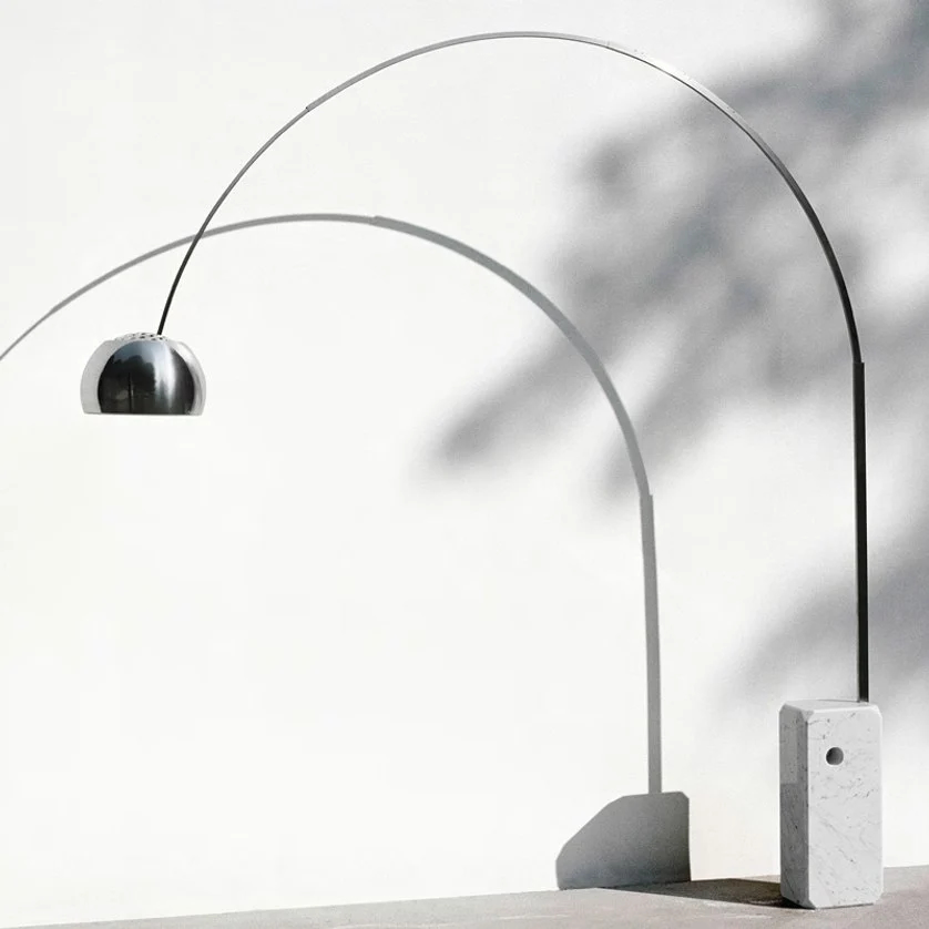 The Arco Modern Floor Lamp with Marble Cube Base illuminates your design with quality lighting and great modern style
