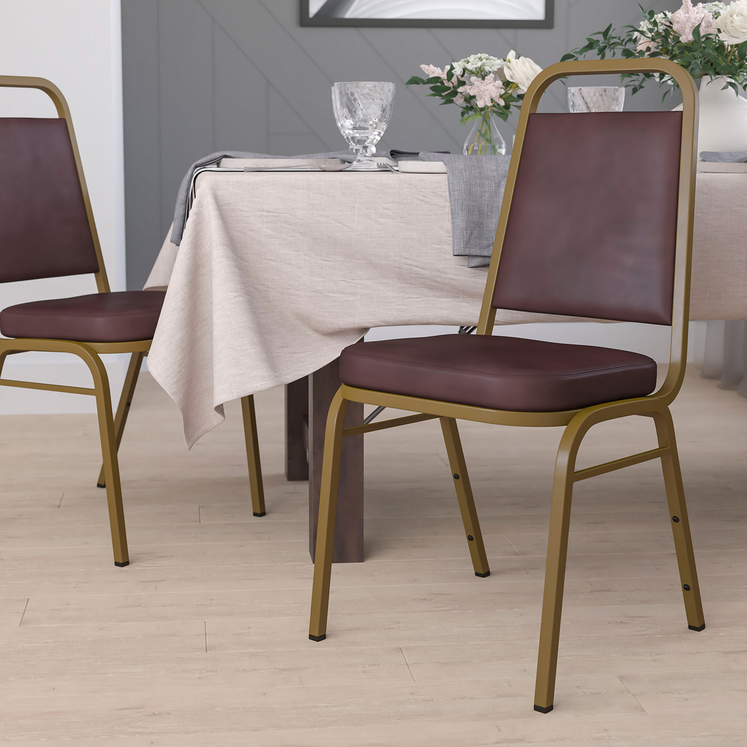 BLNK - HERCULES Series Vinyl Trapezoidal Back Stacking Banquet Chair with Gold Frame
