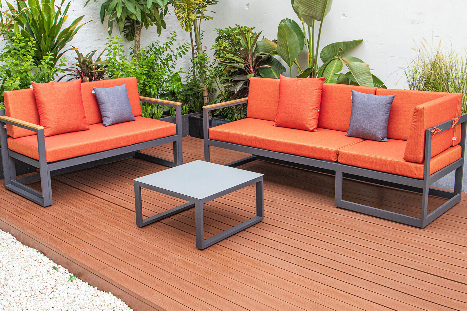 LeisureMod Chelsea Black Sectional with Adjustable Headrest and Coffee Table with Two Tone Cushions - Orange